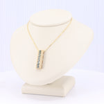 Load image into Gallery viewer, Seven Montana Sapphire Bar Pendant in Yellow Gold
