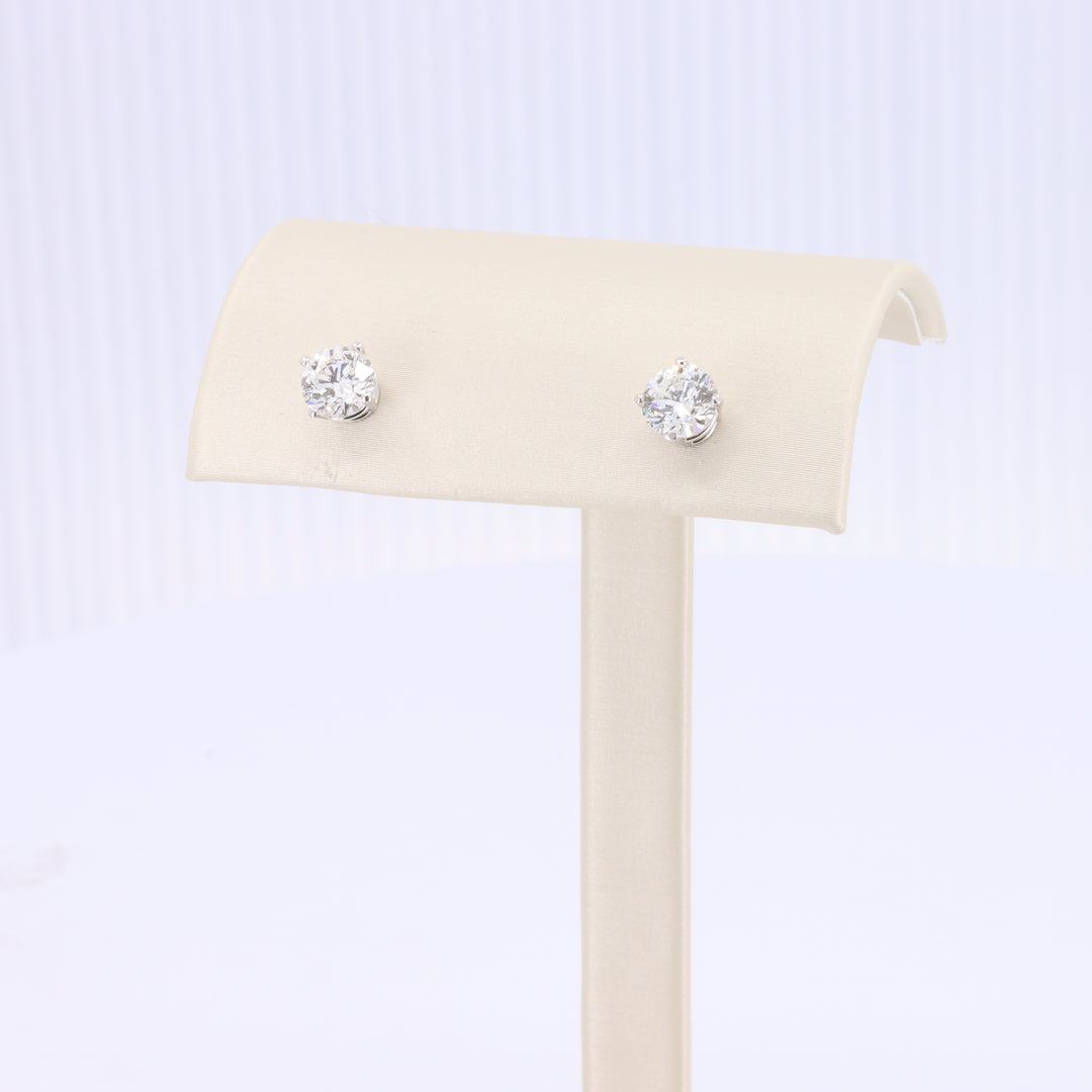 Silver stud earrings featuring sparkling clear cubic zirconia, perfect for elegant day or evening wear.