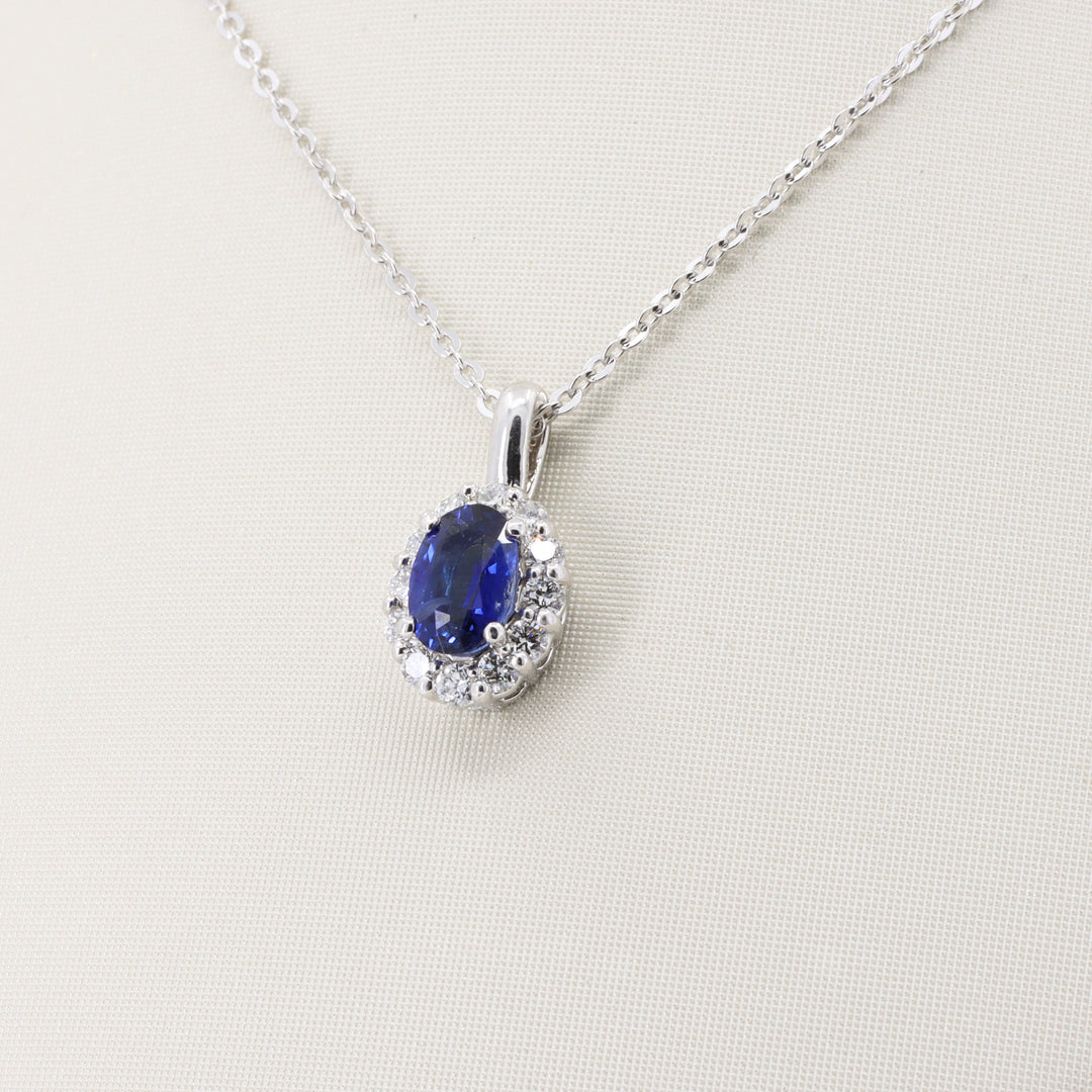 Sapphire and Diamond Halo Pendant, 0.57ct Sapphire and 0.21cttw Diamonds in 14K Yellow Gold, 18 inch Chain