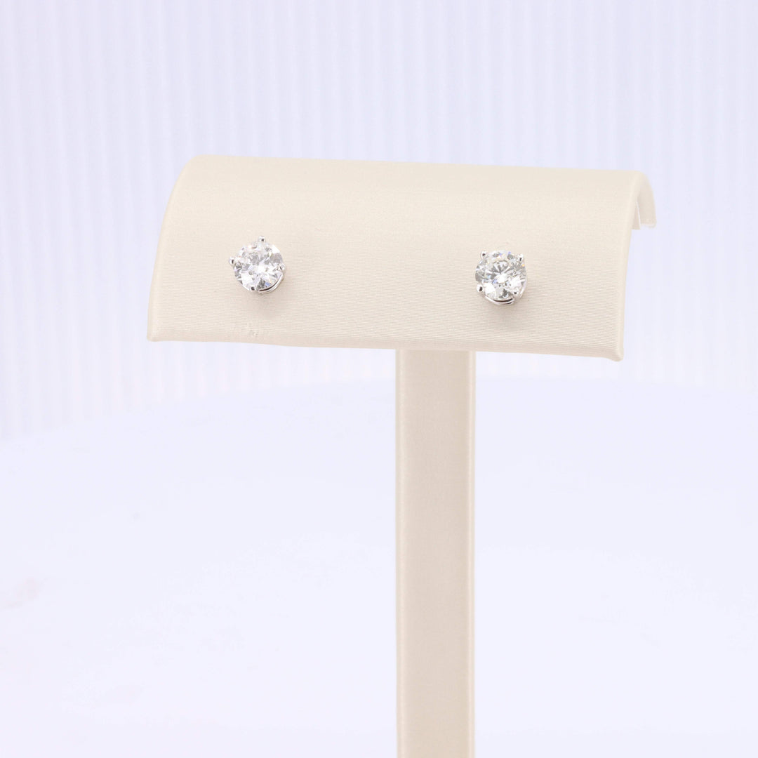 Sterling silver stud earrings with brilliant round clear cubic zirconia gemstones. Elegant and timeless design.
