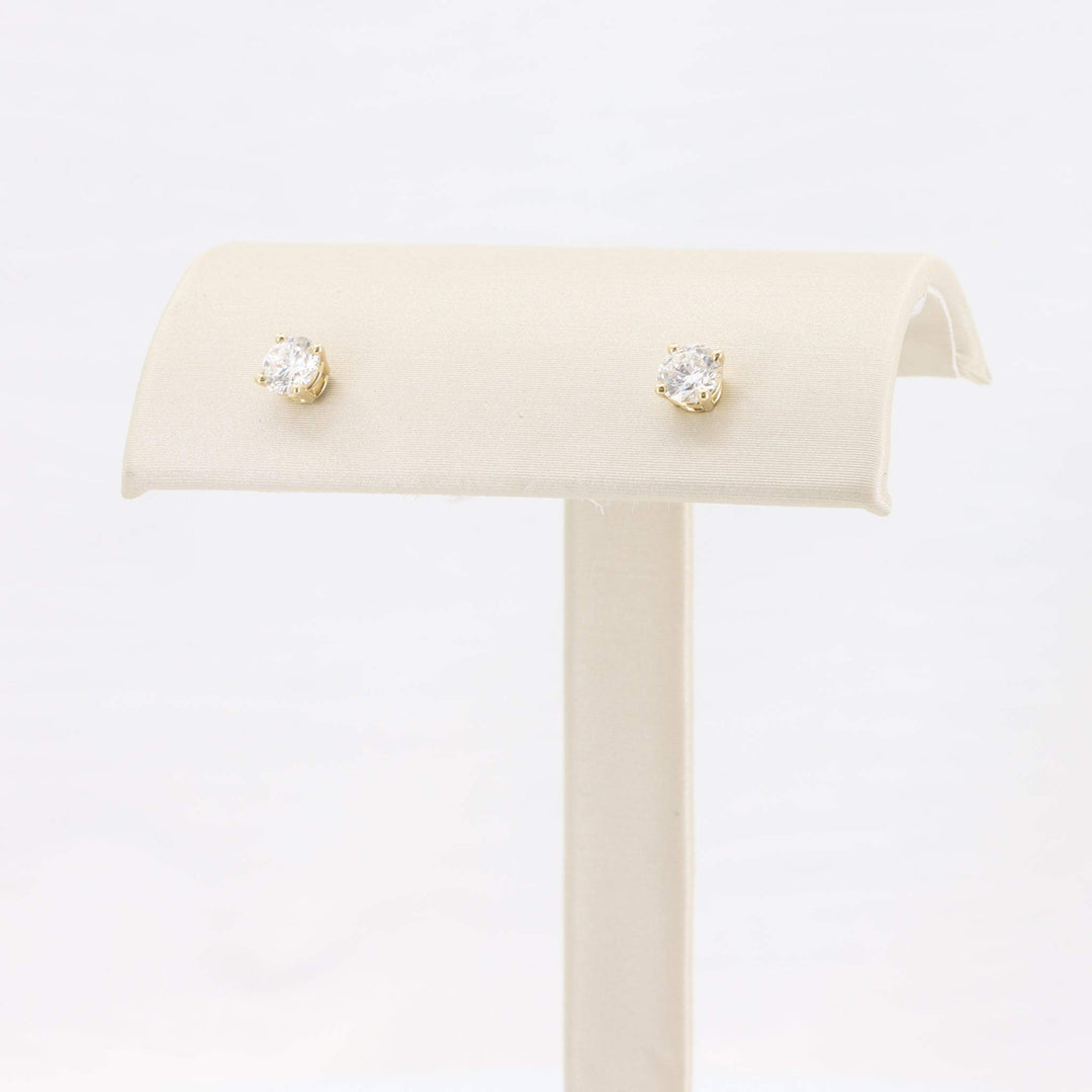 Gold stud earrings with clear cubic zirconia, elegant and timeless design, perfect for any occasion.