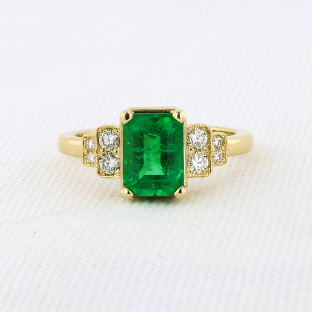 Emerald Ring With Diamond Accents in Yellow Gold