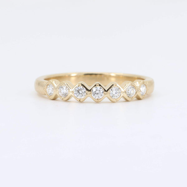 Gold stacking ring with alternating round and marquise-cut diamonds, elegant design, perfect for any occasion.