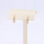 Load image into Gallery viewer, Channel Set Diamond Oval Huggie Earrings in Yellow Gold
