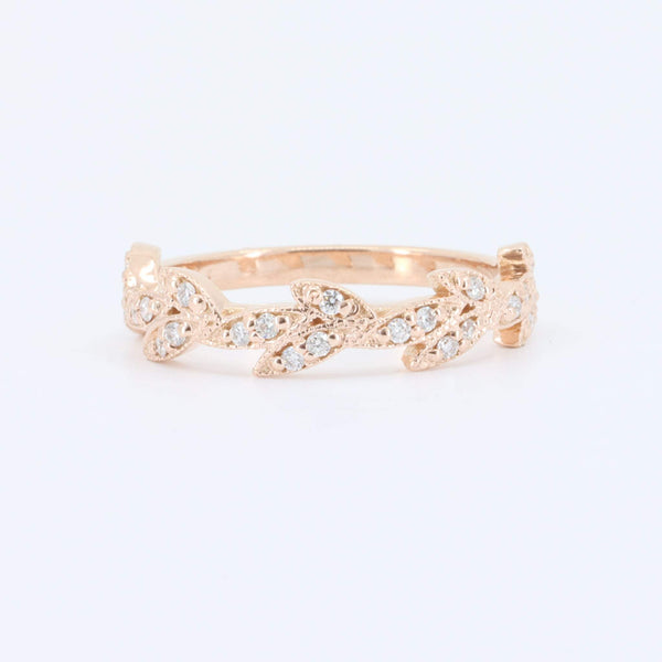 Rose gold leaf design ring with clear sparkling gemstones, perfect for an elegant and stylish accessory.