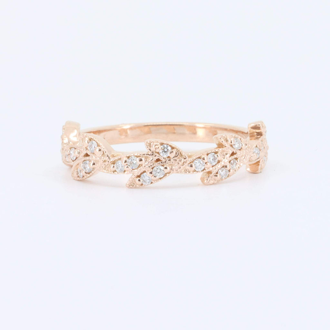 Rose gold leaf design ring with clear sparkling gemstones, perfect for an elegant and stylish accessory.