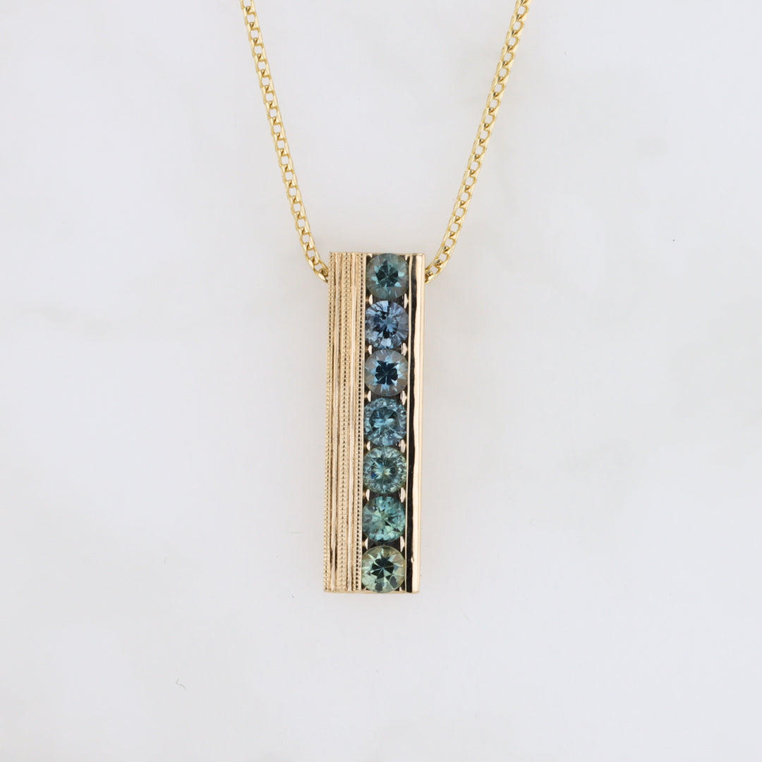 Seven Montana Sapphire Bar Pendant in Yellow Gold