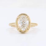 Load image into Gallery viewer, Oval diamond ring in 14K yellow gold, featuring a sparkling center stone with a classic, elegant design.