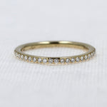 Load image into Gallery viewer, Shared-Prong Wedding Diamond Band in Yellow Gold - 0.16cttw
