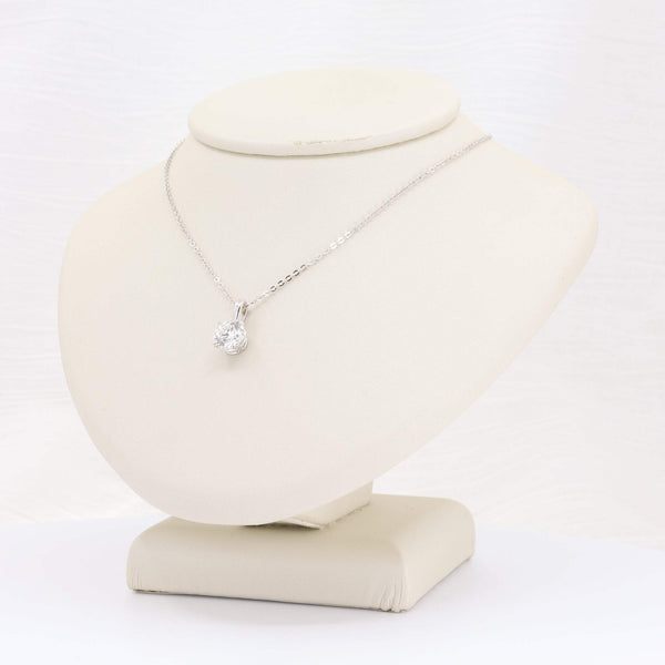 Elegant sterling silver necklace with a sparkling cubic zirconia pendant on a display bust.