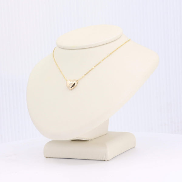 Elegant gold heart necklace with a sparkling diamond, perfect for gifting or personal wear.