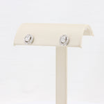 Load image into Gallery viewer, Oval Diamond Stud Earrings, 0.39cttw Center with 0.21cttw Diamond Halo in 14K White Gold