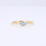 Load image into Gallery viewer, East-West Oval Aquamarine Birthstone Ring in Yellow Gold
