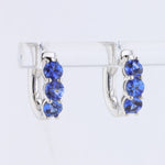 Load image into Gallery viewer, Sapphire Huggie Earrings in White Gold
