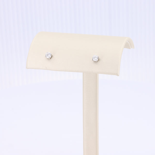 Sleek silver stud earrings with clear cubic zirconia stones, perfect for everyday elegance.