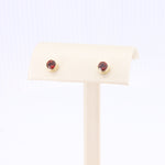 Load image into Gallery viewer, Garnet Bezel Set Stud Earrings in Yellow Gold
