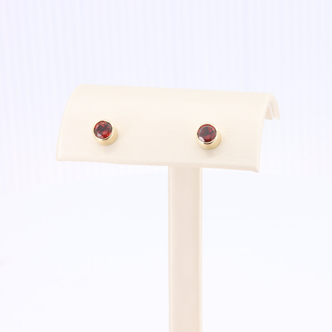 Garnet Bezel Set Stud Earrings in Yellow Gold