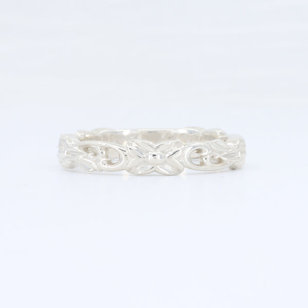 Sterling silver ornate band ring with intricate scroll design, perfect for elegant everyday wear.