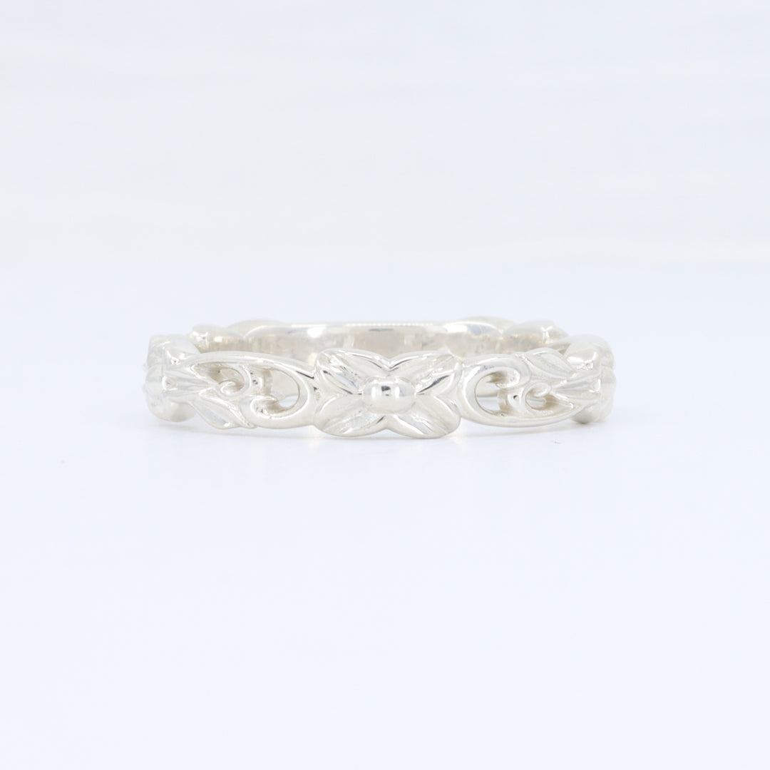 Sterling silver ornate band ring with intricate scroll design, perfect for elegant everyday wear.