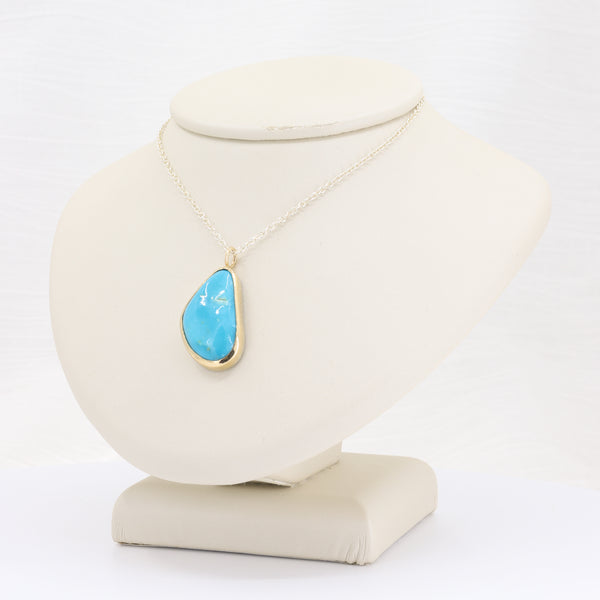 Freeform turquoise gold-bezel pendant on 18-inch sterling silver chain