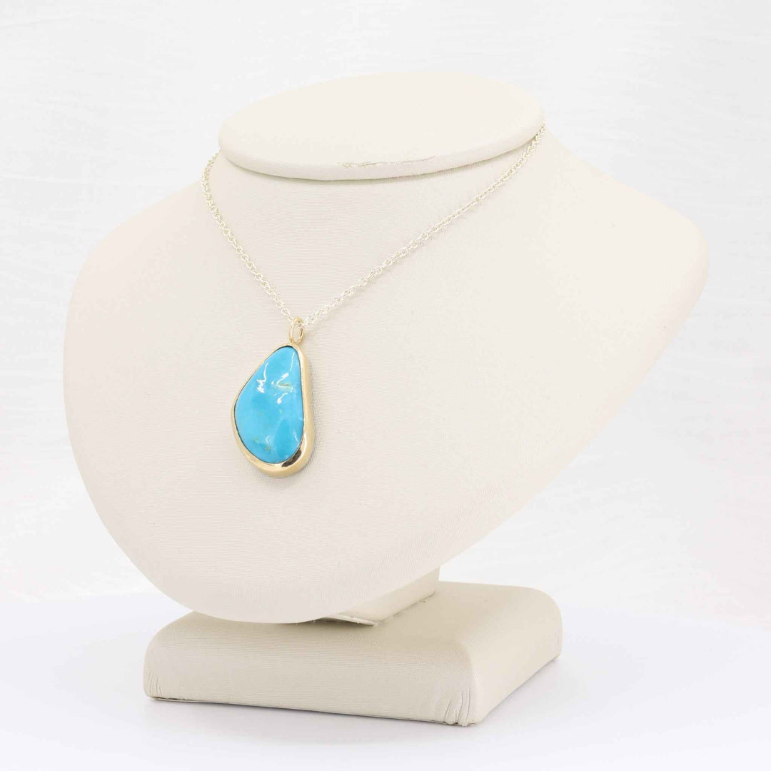 Freeform Turquoise Bezel Pendant, 11.86ct in 14K Yellow Gold with Sterling Silver Chain, 18 inch Chain - Kizer Cummings Jewelers