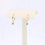 Load image into Gallery viewer, Diamond Drop Huggie Earrings in Yellow Gold
