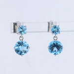 Load image into Gallery viewer, Two Stone Blue Topaz Drop Earrings in White Gold
