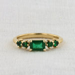 Load image into Gallery viewer, East-West Emerald-cut Emerald Ring in Yellow Gold
