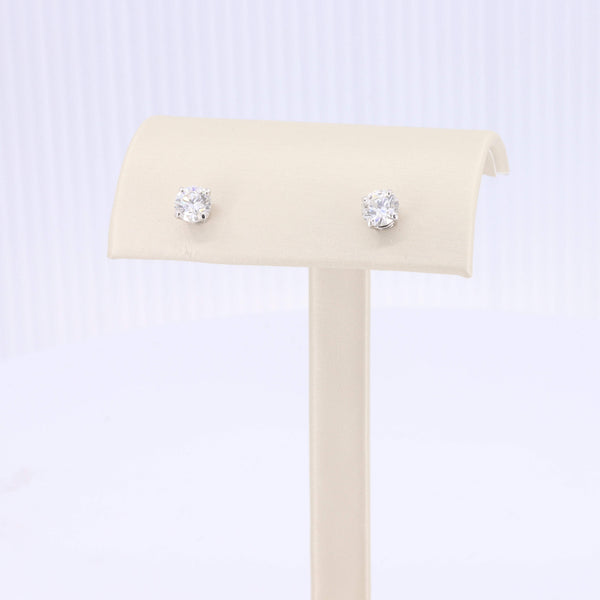 Elegant silver stud earrings with sparkling clear cubic zirconia stones, perfect for brides or special occasions.