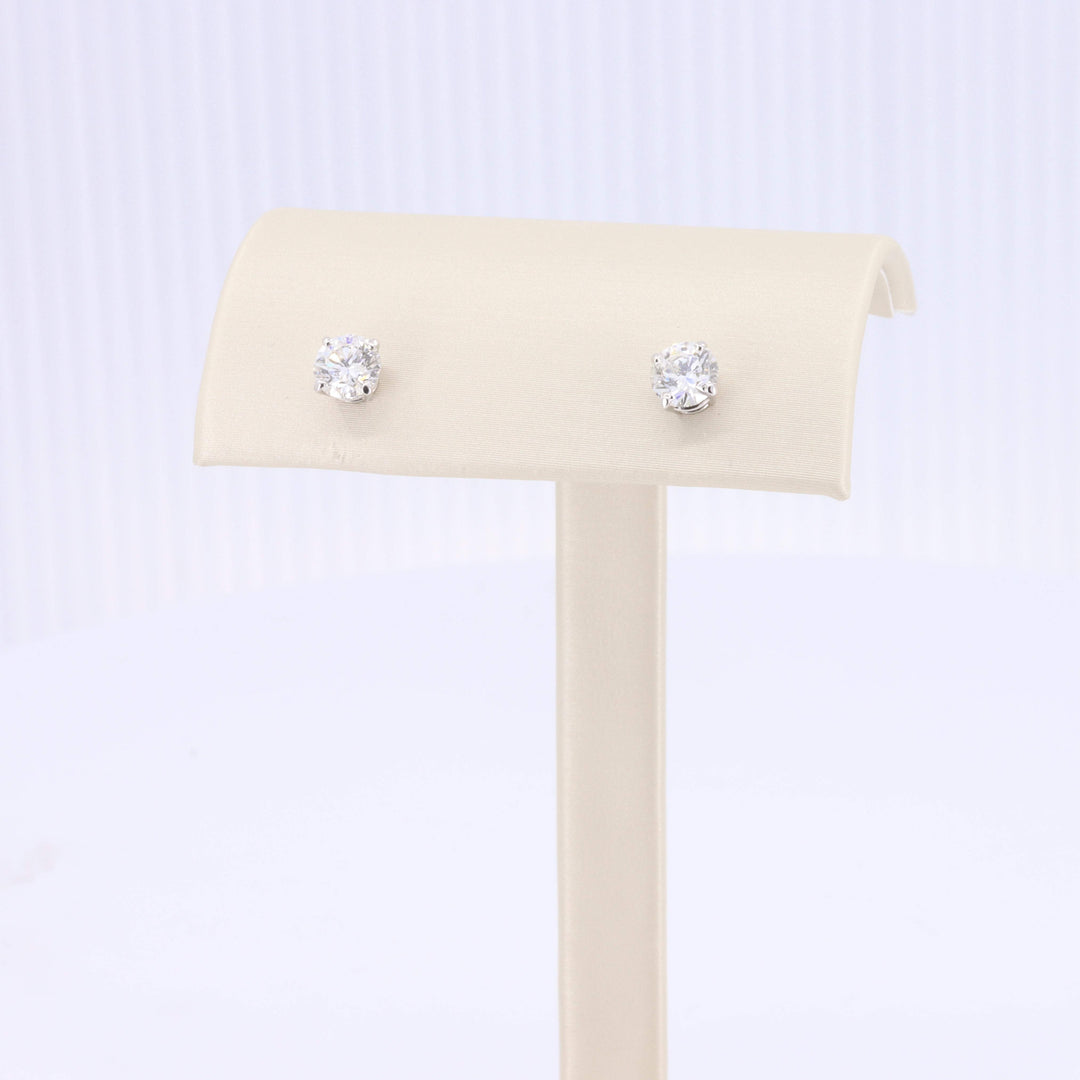 Elegant silver stud earrings with sparkling clear cubic zirconia stones, perfect for brides or special occasions.